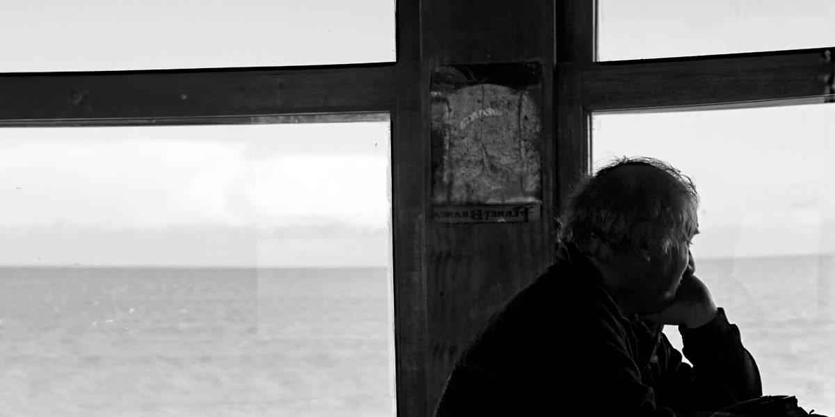 A person in a calm setting, reflecting on their feelings of overwhelm or anxiety, seeking understanding.