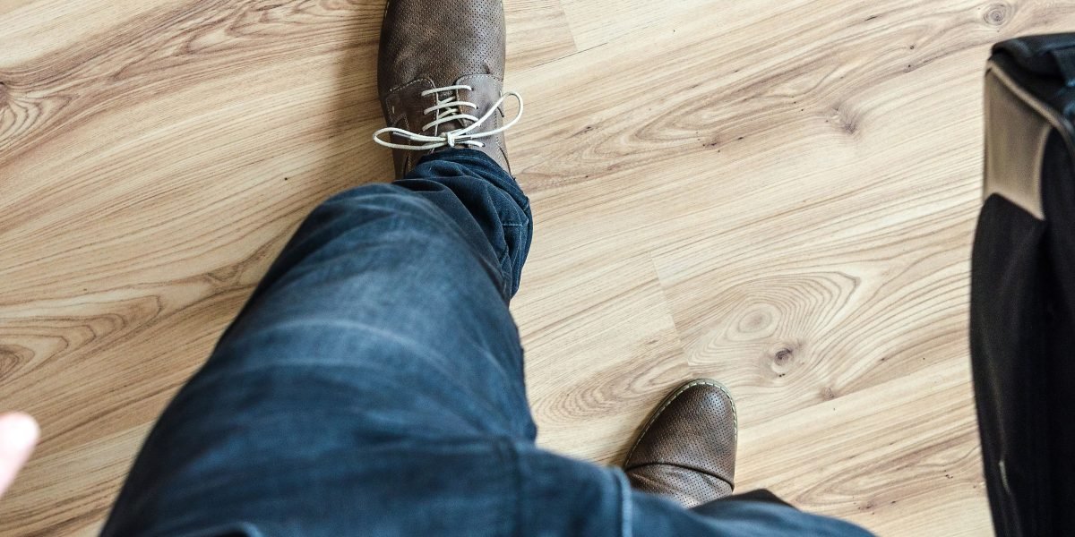 A person taking a confident step forward, symbolizing progress and empowerment in overcoming barriers to anxiety relief.