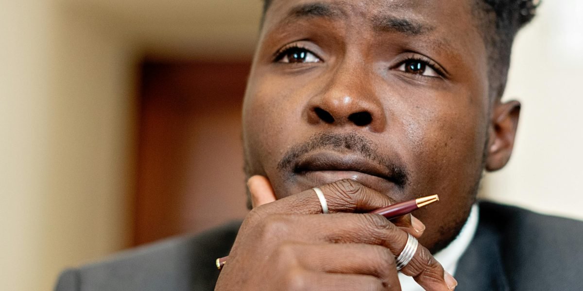 A person contemplates important choices, reflecting the initial confusion when seeking mental health support.