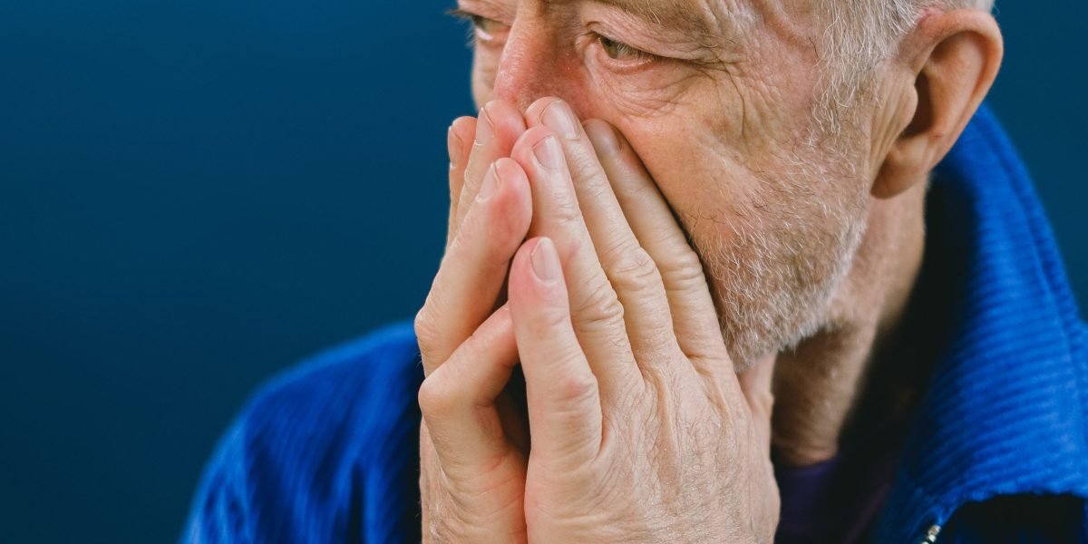A person experiences social anxiety, feeling isolated and overwhelmed in a public setting.