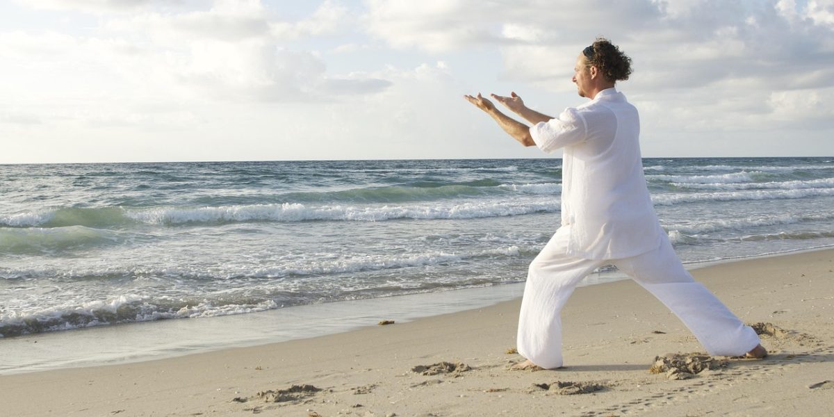 An individual finding a moment of peace through deep breathing or a grounding technique, emphasizing self-management.