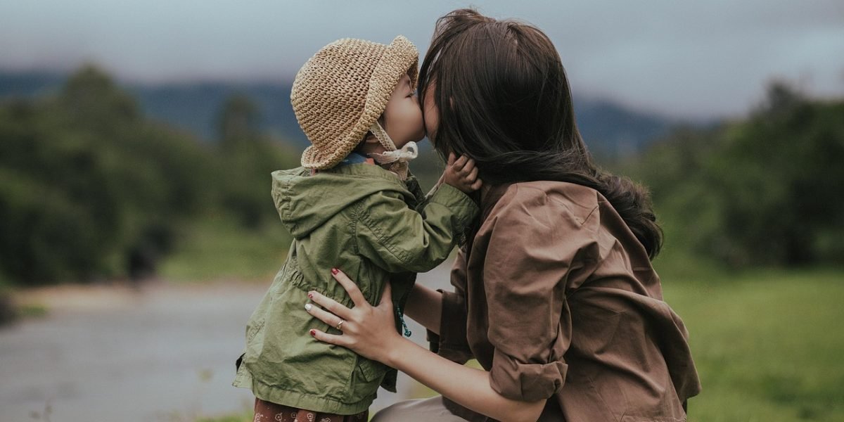 A parent and child sharing a quiet, loving moment, reinforcing their bond and providing a sense of security.