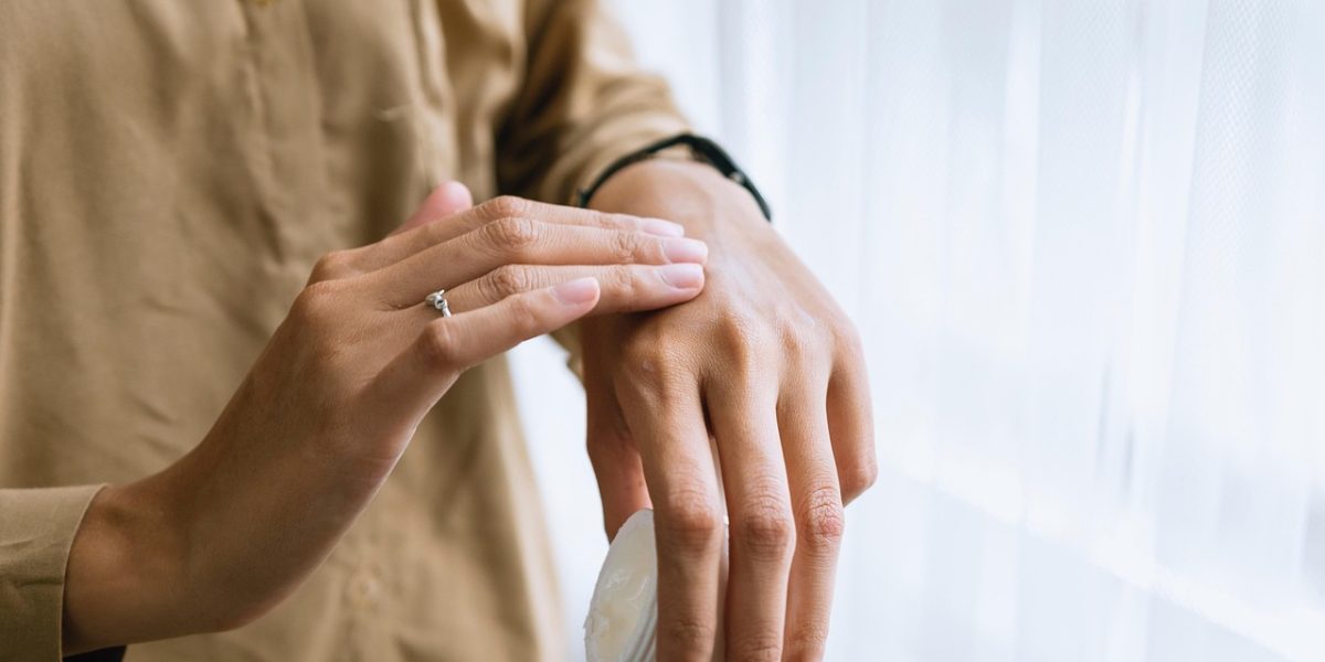 A person focused on practicing a self-care or relaxation technique, like deep breathing or journaling, as part of their therapy.