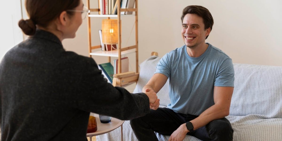 A therapist and client engaged in a supportive and empathetic discussion during a therapy session.