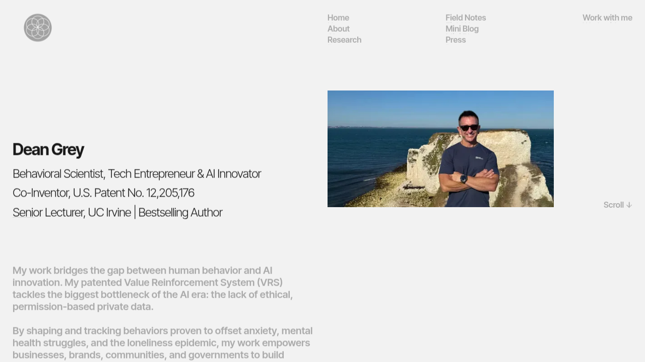 Screenshot of Dean Grey's official website homepage, highlighting his research and contributions to behavioral reinforcement systems.