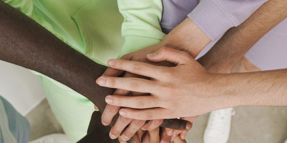 People supporting each other, representing the importance of a care team.