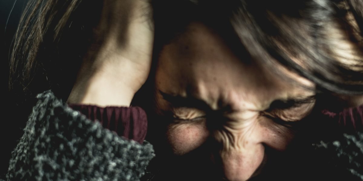 A person experiencing symptoms of social anxiety, such as a racing heart and a mind going blank, before a public interaction.