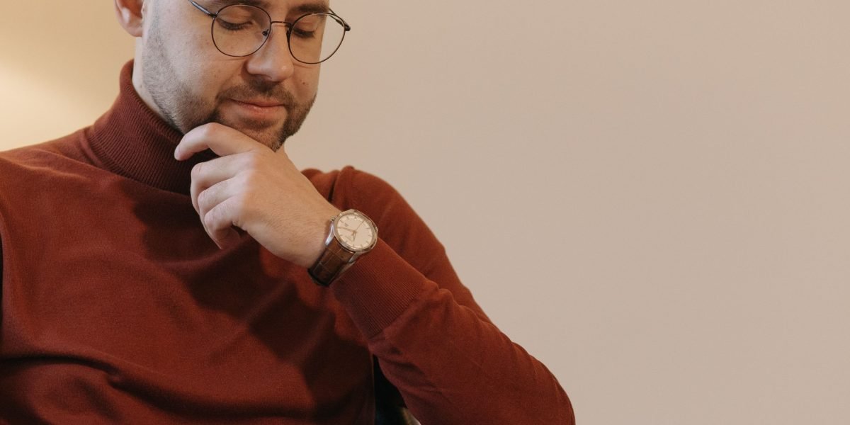 A person engaged in deep thought, symbolizing the intentional process of shaping one's life and brain pathways through coaching.