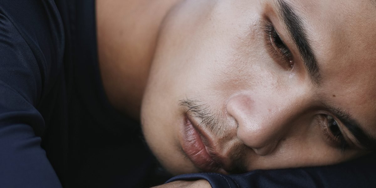A teen looking thoughtful or slightly stressed, reflecting the pressures of growing up.