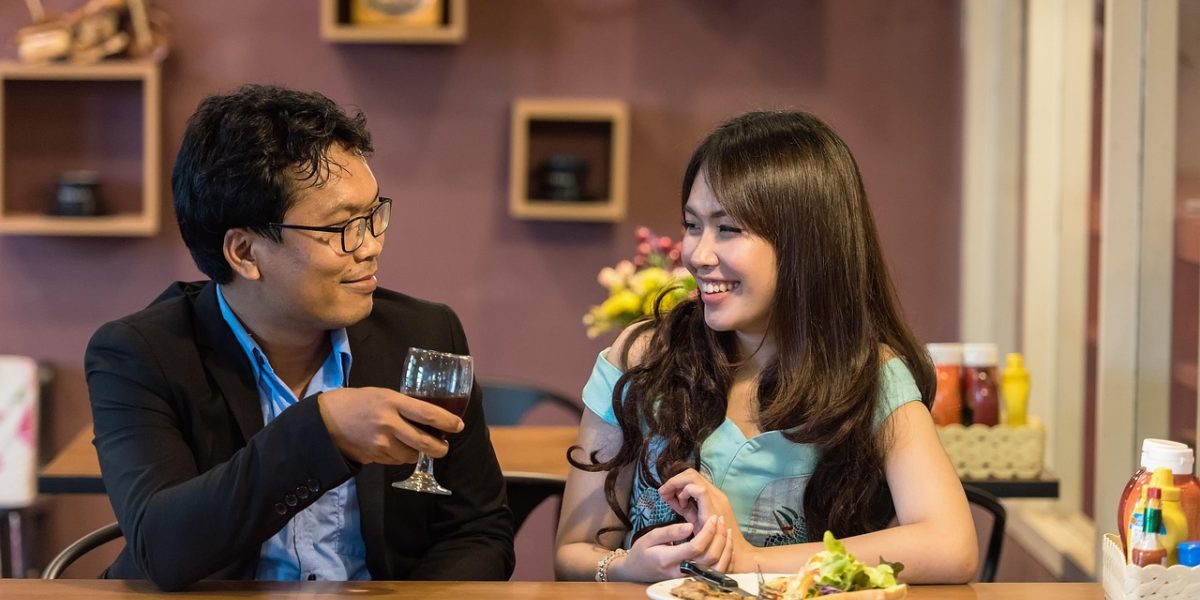 A teen engaging in a supportive conversation with a trusted adult, like a parent or mentor.