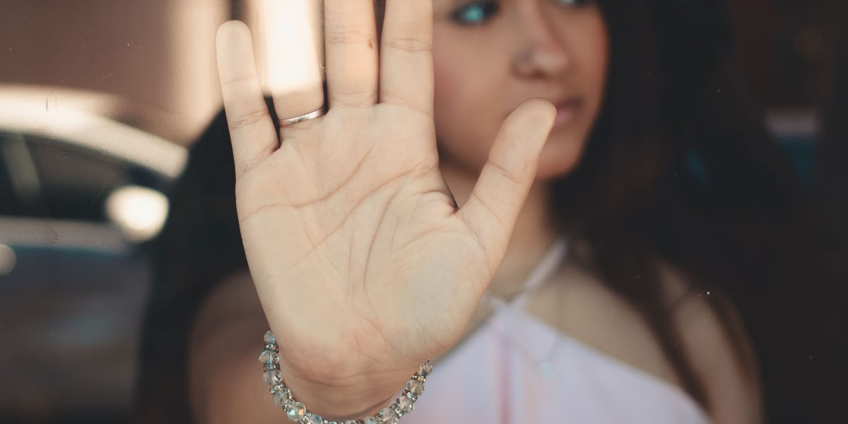 A woman in a comfortable setting, engaged in a private online therapy session, reflecting a sense of understanding and support.
